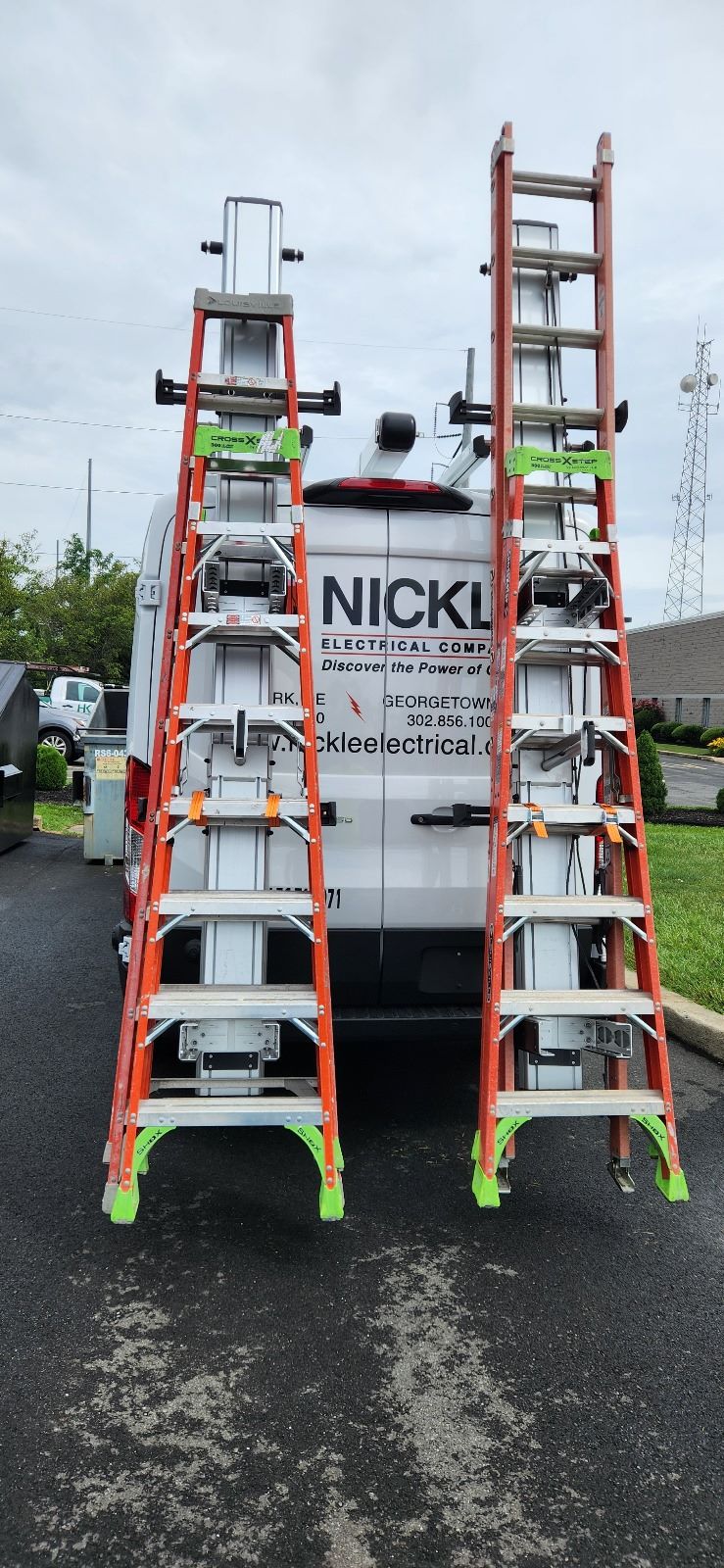commercial fleet work van with Two drop down ladders for electrical company