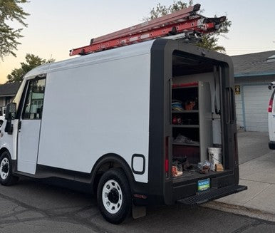 chevrolet brightdrop service work van at home with drop down ladder rack