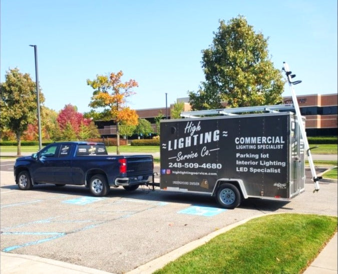 enclosed cargo trailer for contractors with ladder rack drop down for lighting company