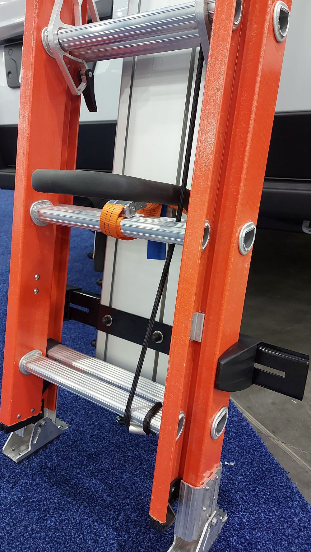 close, drop down ladder rack with orange ladder