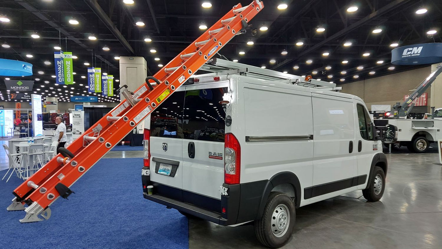 white ram promaster van with drop down ladder rack