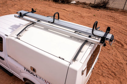 harrier drop down ladder rack on truck topper