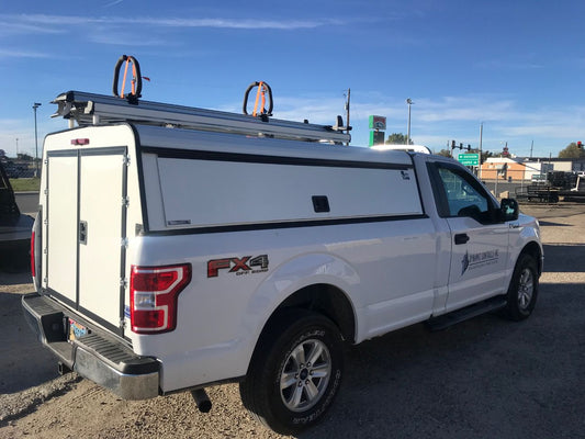 commercial fleet ford white truck drop down ladder on top of work aluminum topper cap