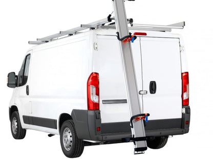 White commercial cargo van with a ladder rack drop down