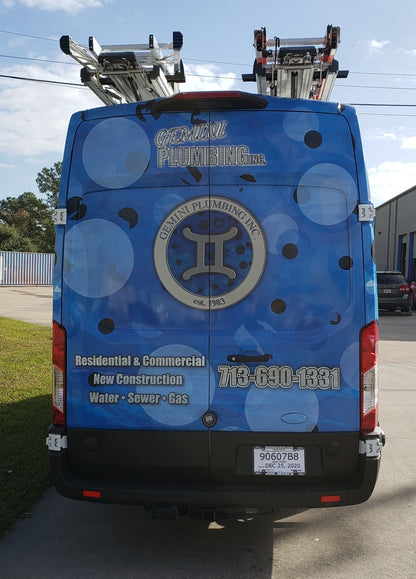 ram promaster with 2 ladder racks and blue wrap advertising plumbing business